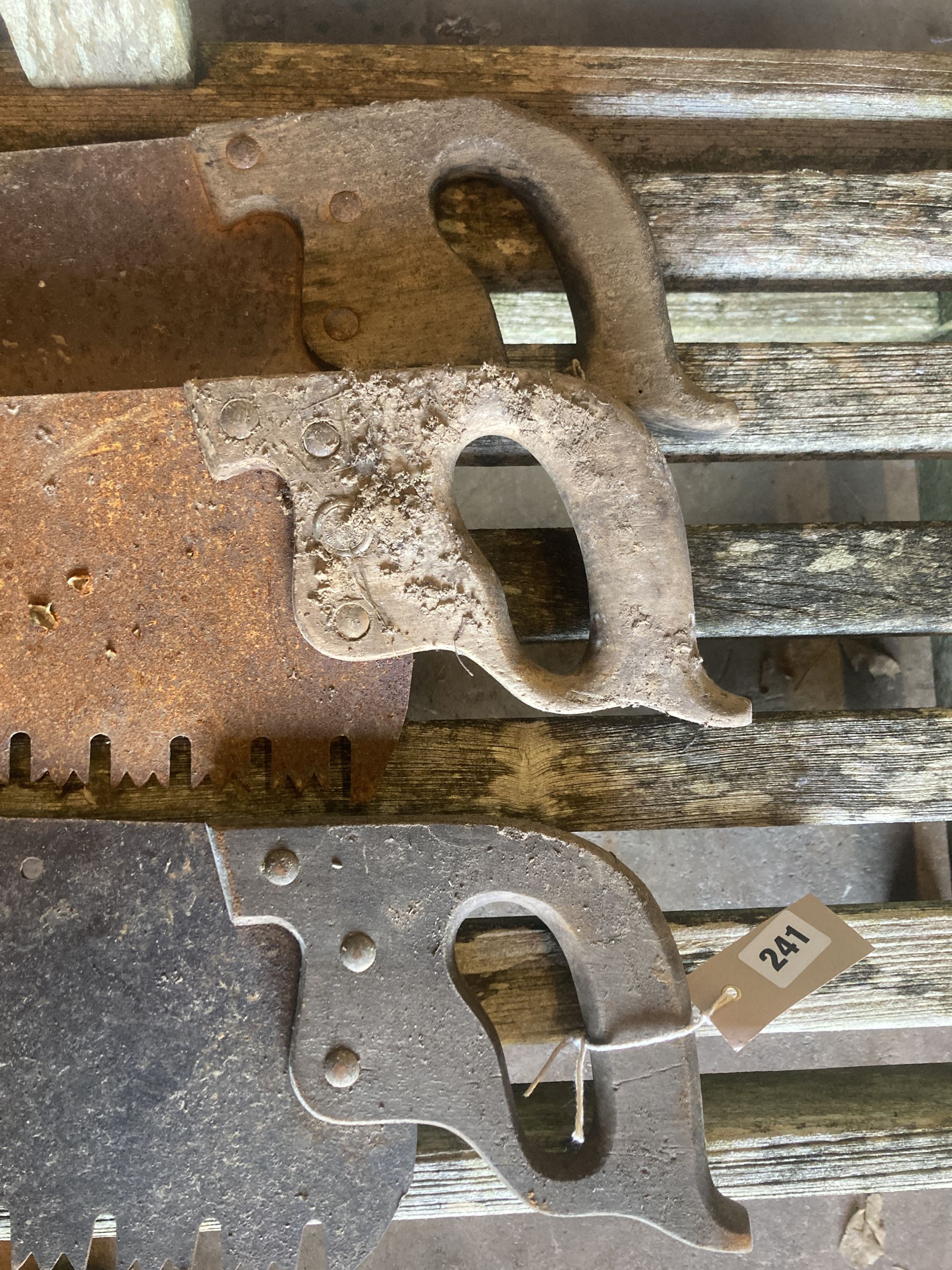Three vintage hand saws, largest 120cm